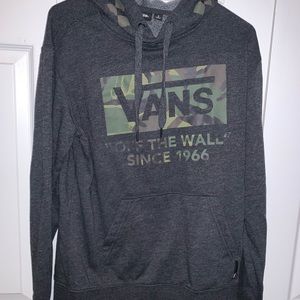 Soft Gray and camo vans pull over.